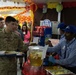 Soldiers stand in line for Thanksgiving meal at Camp Arifjan
