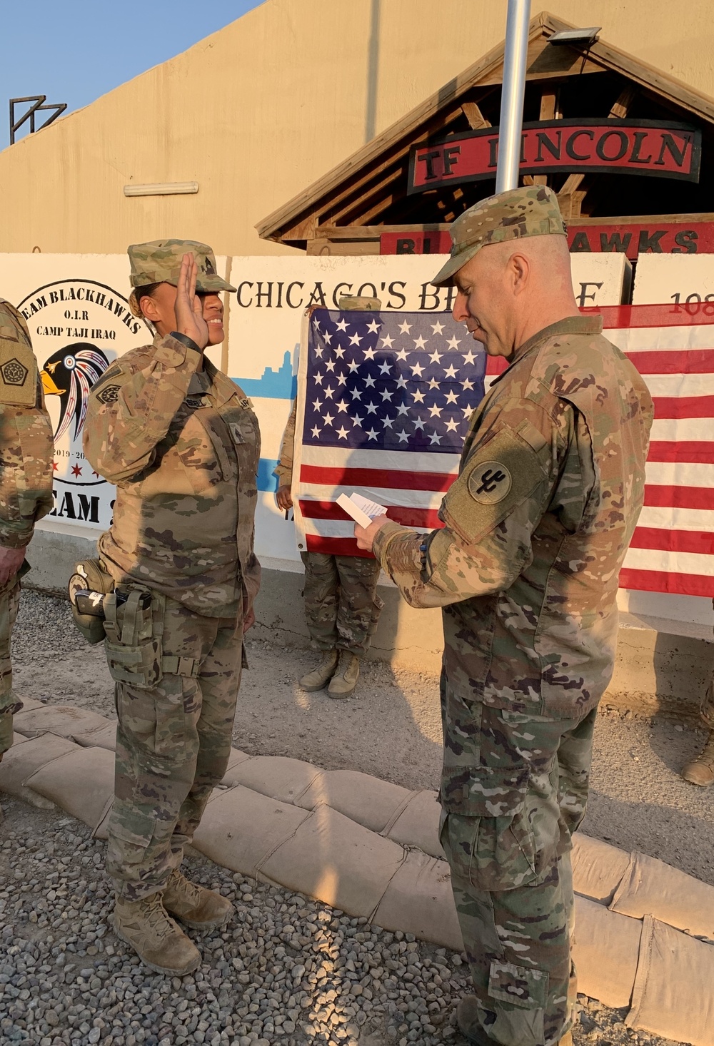 Illinois Army National Guard noncommissioned officer reenlists in Camp Taji, Iraq