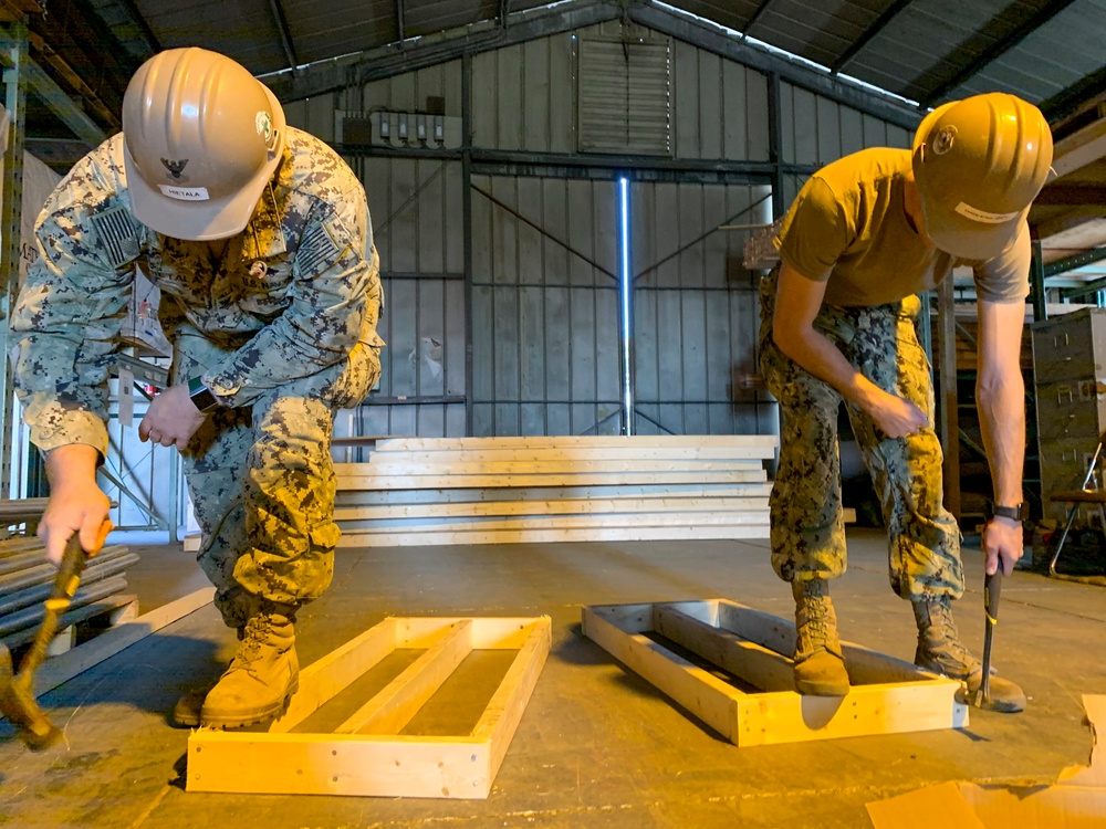 U.S. Navy Seabees deployed with NMCB-5's Detail Atsugi construct a loading dock at the Navy Exchange, Naval Air Facility Atsugi