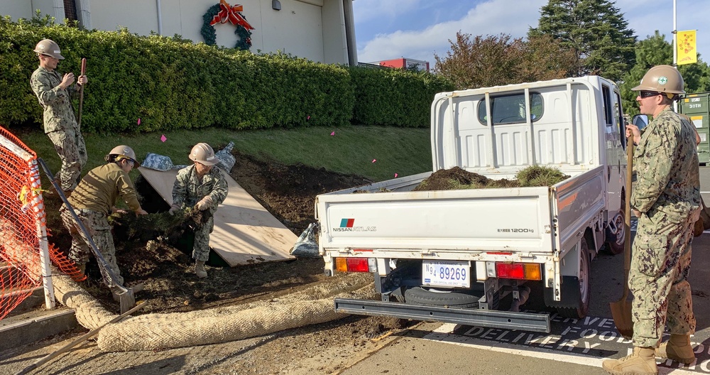 U.S. Navy Seabees deployed with NMCB-5's Detail Atsugi construct a loading dock at the Navy Exchange, Naval Air Facility Atsugi