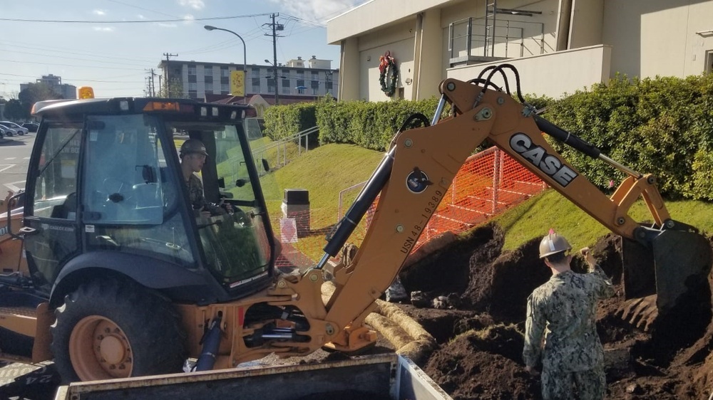 U.S. Navy Seabees deployed with NMCB-5's Detail Atsugi construct a loading dock at the Navy Exchange, Naval Air Facility Atsugi