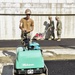 U.S. Navy Seabees with NMCB-5 place asphalt at Camp Shields