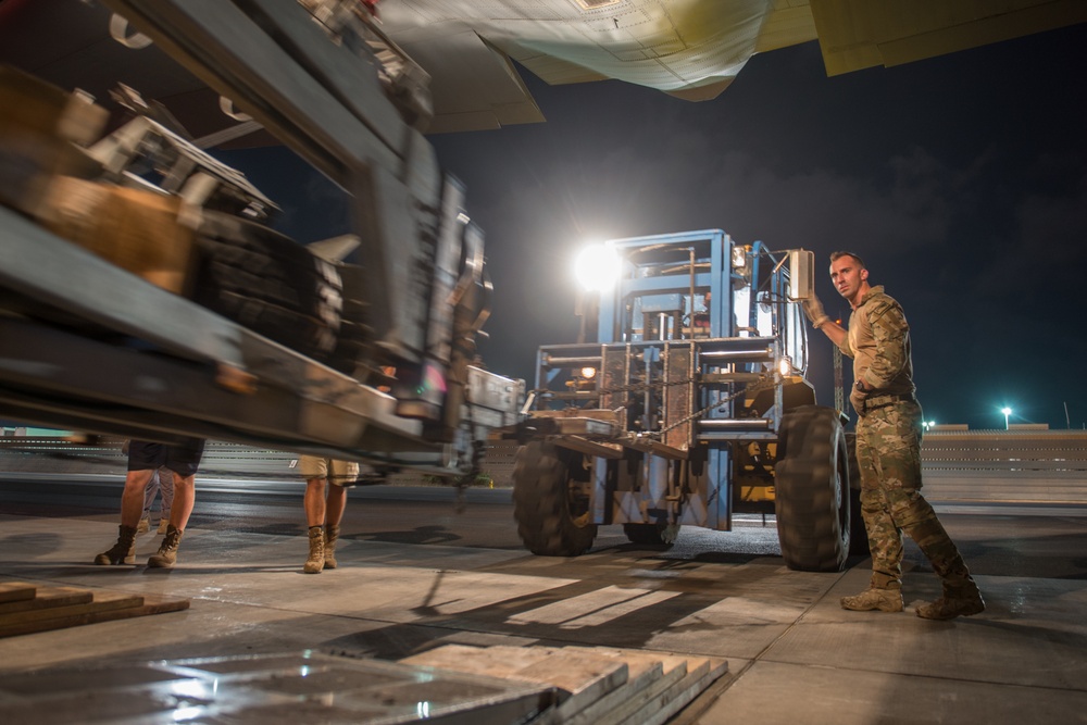 75th Expeditionary Airlift Squadron resupplies units at night