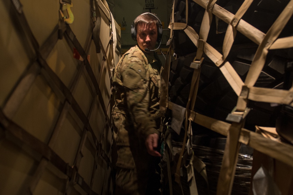 75th Expeditionary Airlift Squadron resupplies units at night