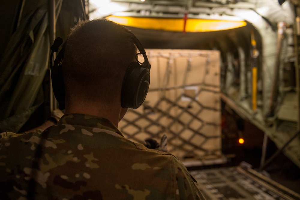 75th Expeditionary Airlift Squadron resupplies units at night