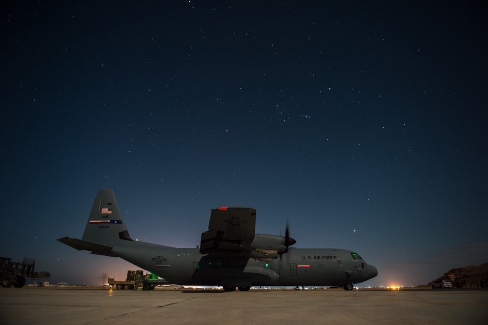 75th Expeditionary Airlift Squadron resupplies units at night