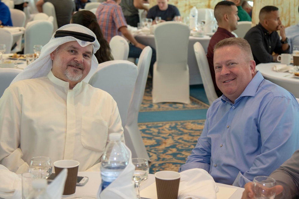 Special Advisor to His Highness the Amir and 386th AEW commander meet at holiday banquet