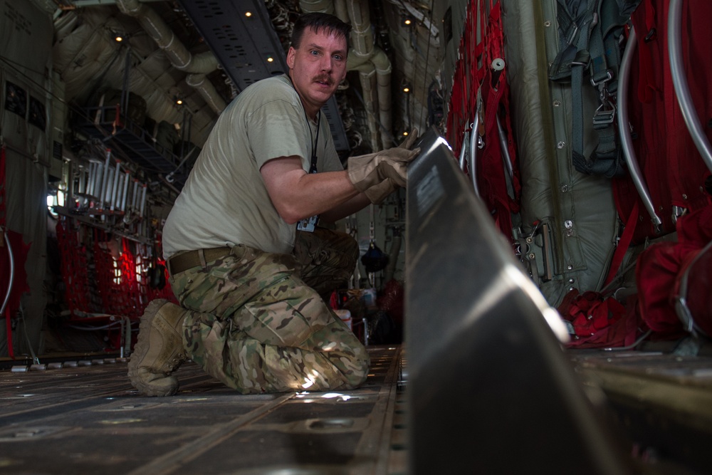 75th Expeditionary Airlift Squadron and 82nd Expeditionary Rescue Squadron train in water jumps