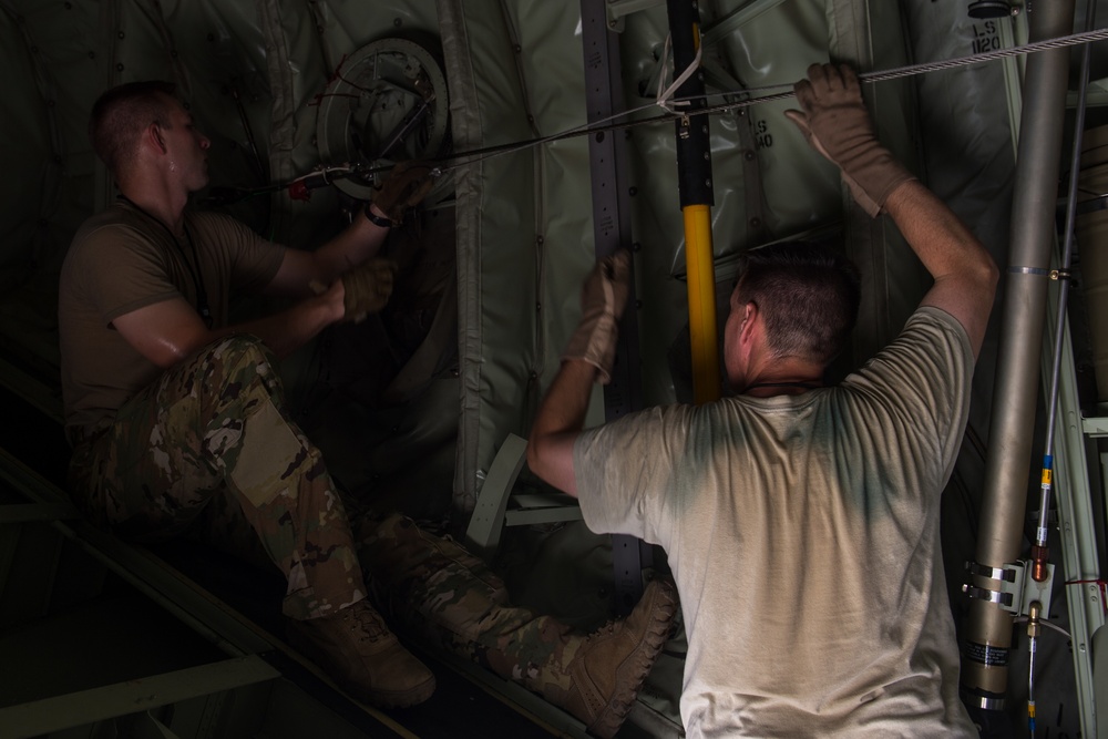 75th Expeditionary Airlift Squadron and 82nd Expeditionary Rescue Squadron train in water jumps