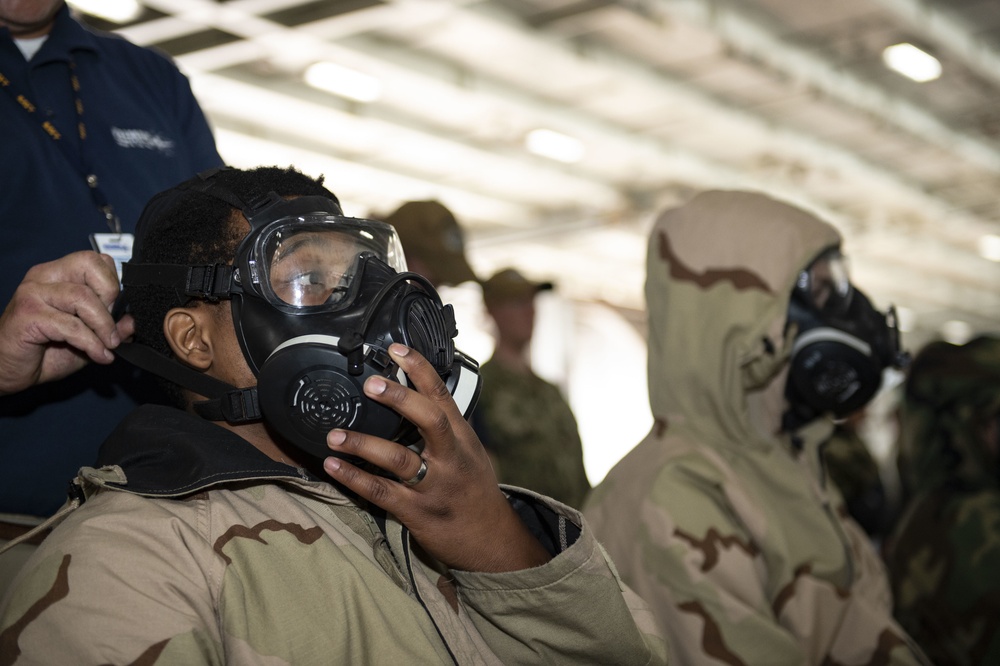 Sailors Aboard the USS Dwight D. Eisenhower (CVN69) Are Fitted for Gas Masks