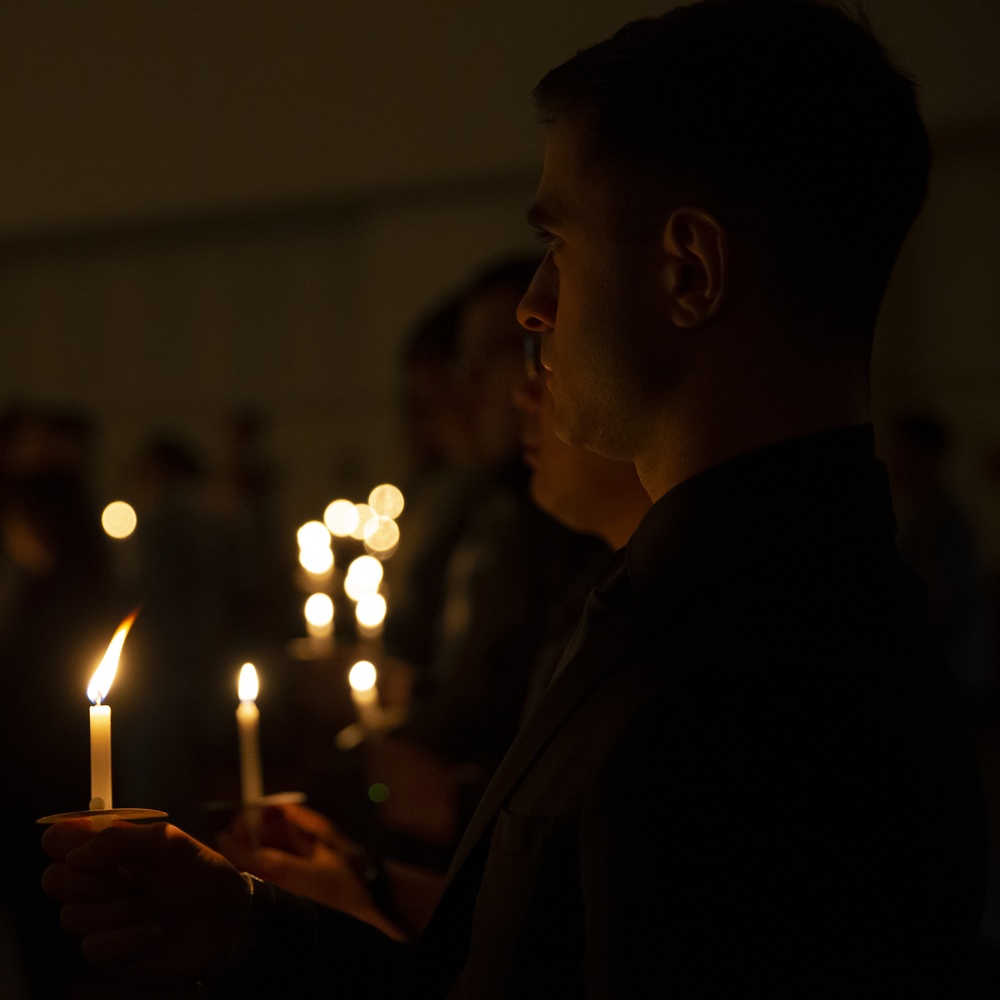 Honor the fallen: Sumos and Bats hold candlelight vigil