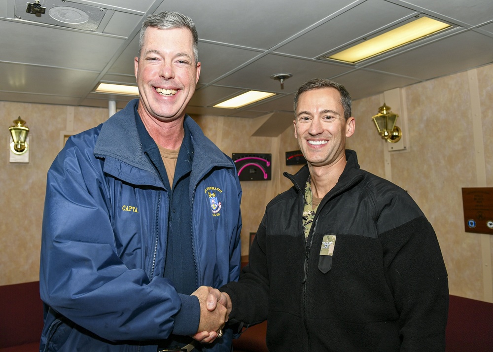 USS Normandy Captain Hosts Commander, Task Force 65