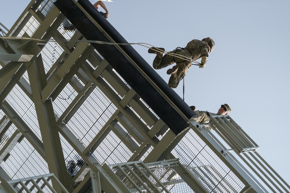 Soldiers from 1157th Transportation Company participate in team building exercises at the Rappel tower, Total Force Training Center Fort McCoy