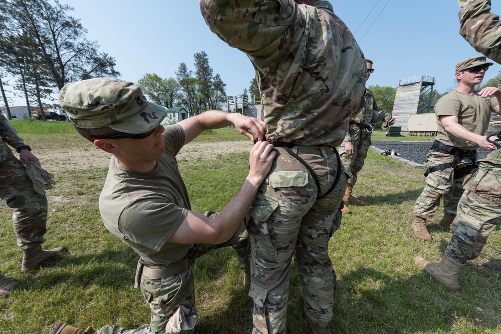 Soldiers from 1157th Transportation Company participate in team building exercises at the Rappel tower, Total Force Training Center Fort McCoy