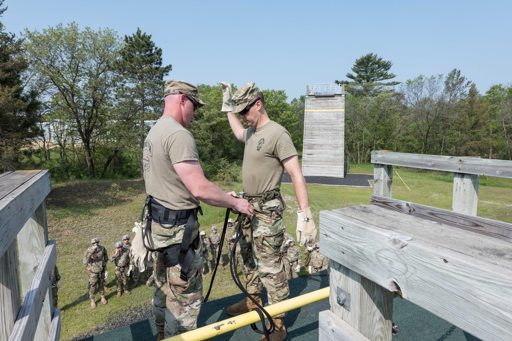 Soldiers from 1157th Transportation Company participate in team building exercises at the Rappel tower, Total Force Training Center Fort McCoy