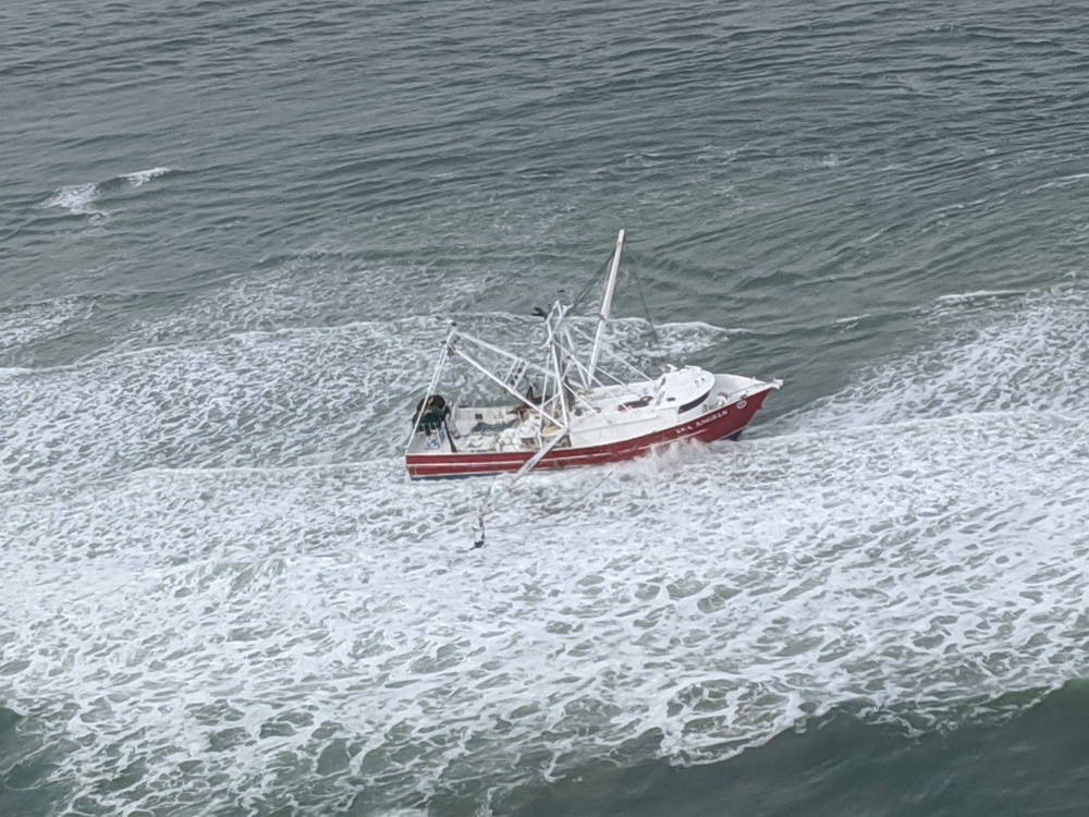 The Coast Guard hoisted four fishermen from an 88-foot fishing vessel in Browns Inlet, North Carolina.