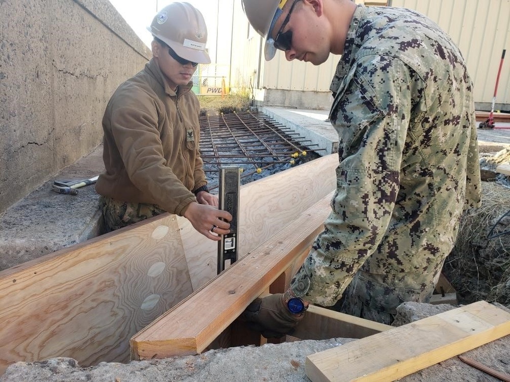 U.S. Navy Seabees deployed with Naval Mobile Construction Battalion 5’s Detail Sasebo work on the seawall repair project on board Commander Fleet Activities Sasebo