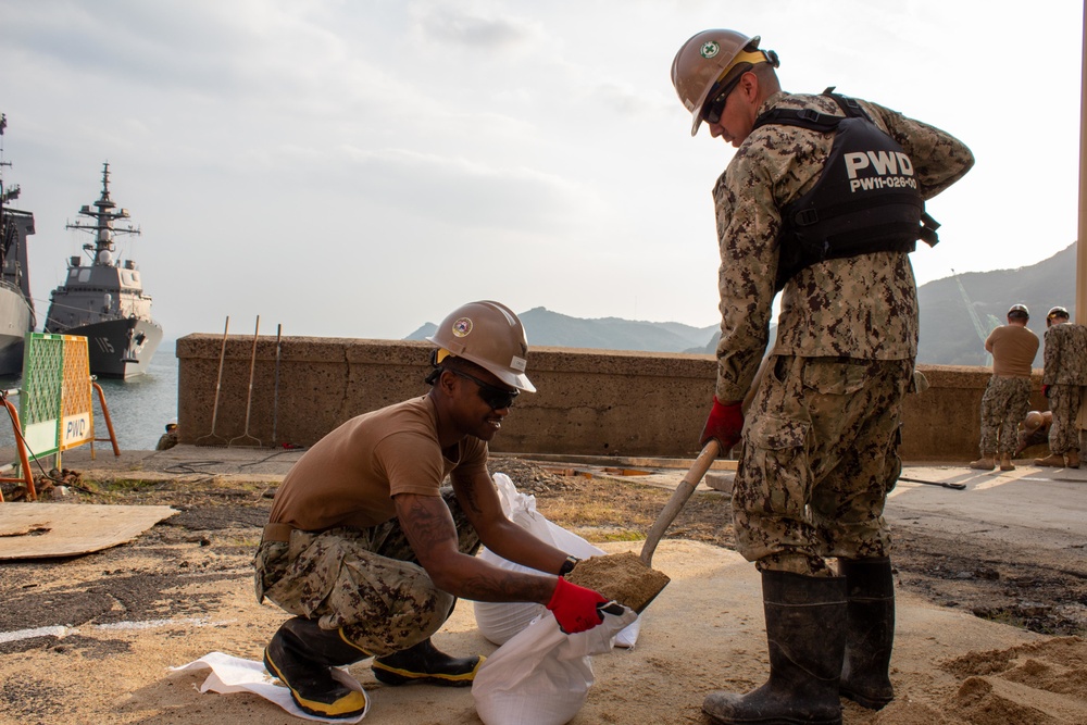 U.S. Navy Seabees deployed with Naval Mobile Construction Battalion 5’s Detail Sasebo work on the seawall repair project on board Commander Fleet Activities Sasebo