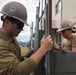U.S. Navy Seabees deployed with NMCB-5’s Detail Iwakuni continue construction on environmental enclosures