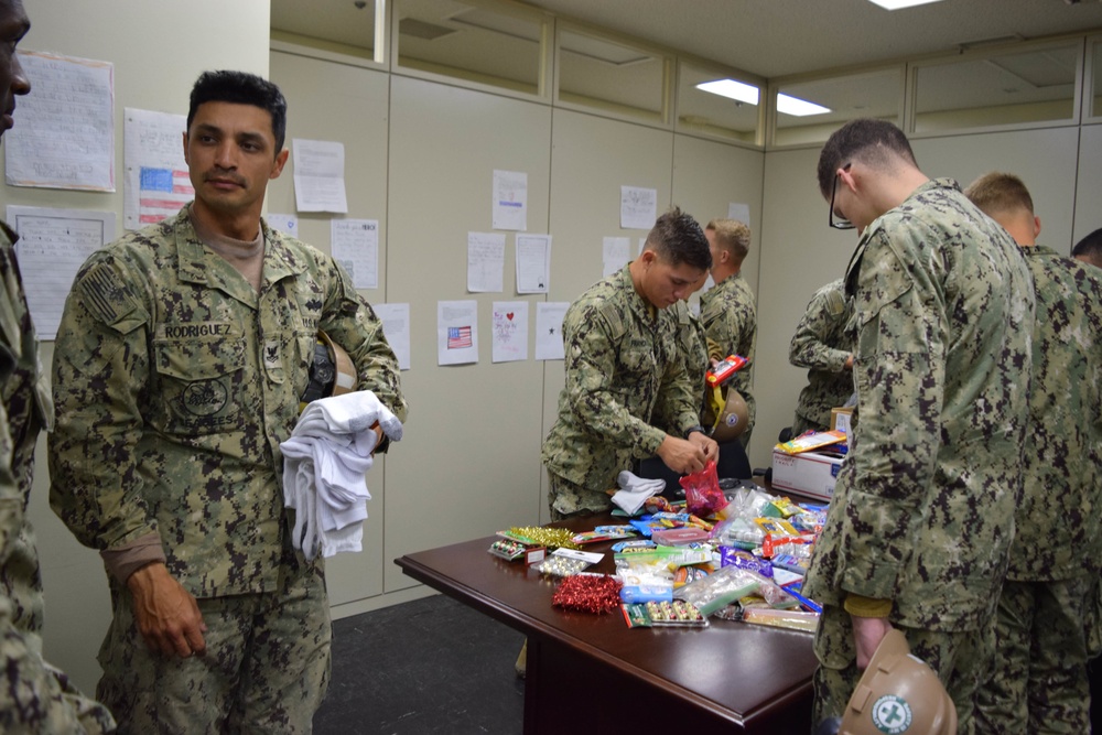U.S. Navy Seabees deployed with NMCB-5’s Detail Iwakuni receive care packages