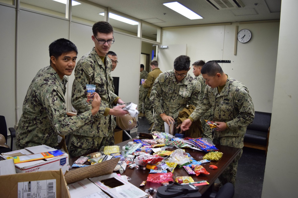 U.S. Navy Seabees deployed with NMCB-5’s Detail Iwakuni receive care packages