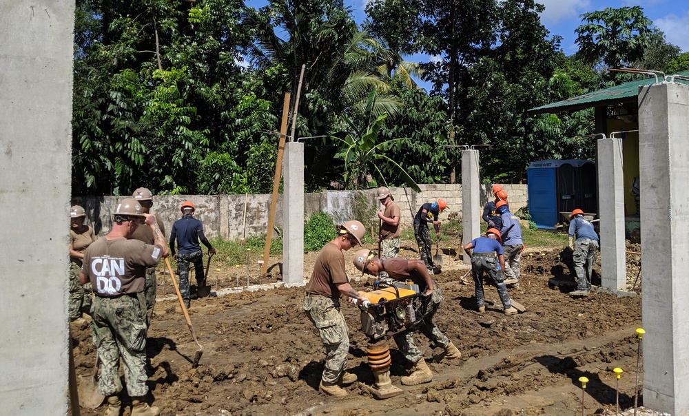 U.S. Navy Seabees deployed with NMCB-5’s Detail Palawan continue construction on Malatgao Elementary School