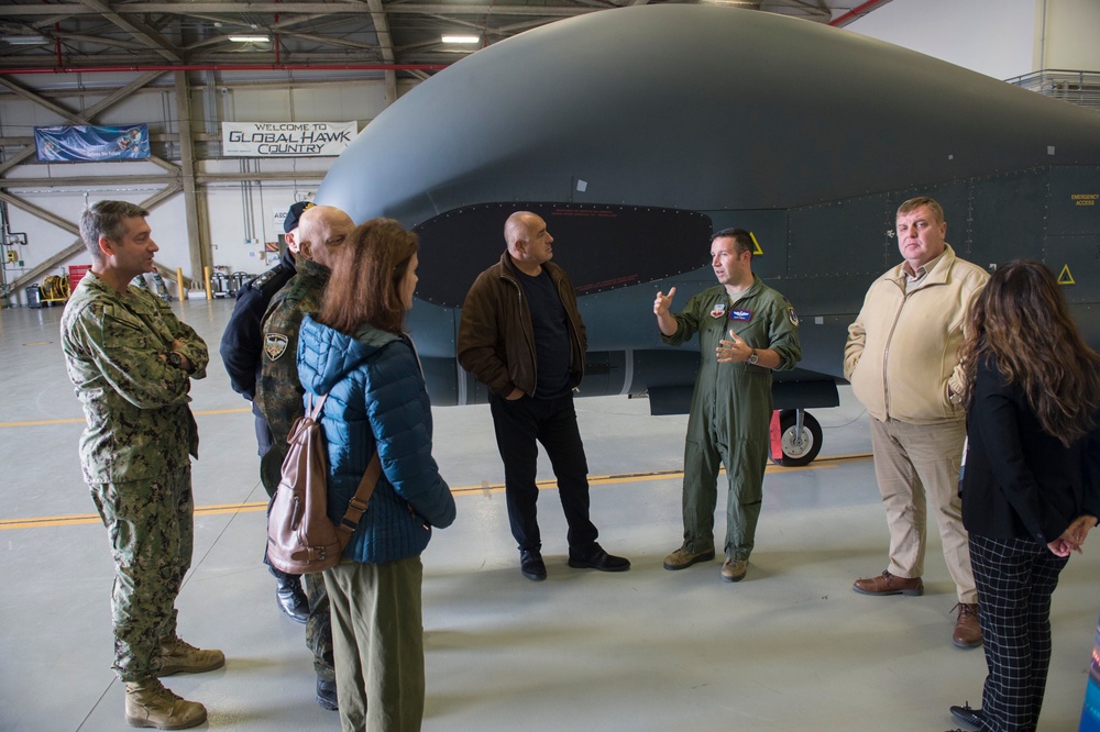 Lt. Col. Douglas Pruitt, executive officer, 7th Reconnaissance Squadron, talks with a delegation from  Bulgaria onboard Naval Air Station (NAS) Sigonella.