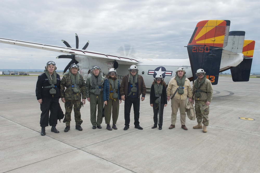 A delegation from Bulgaria poses for a photo prior to boarding a C-2A Greyhound onboard NAS Sigonella