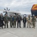 A delegation from Bulgaria poses for a photo prior to boarding a C-2A Greyhound onboard NAS Sigonella