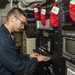 USS Normandy Sailor Inserts Disc Into SITE TV
