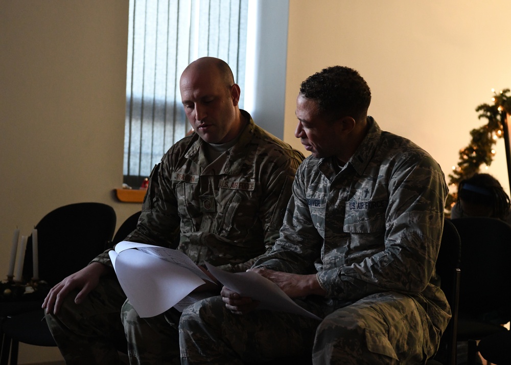 Airmen from the 104th Fighter Wing attend Candlelight service