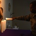 Airmen from the 104th Fighter Wing attend Candlelight service