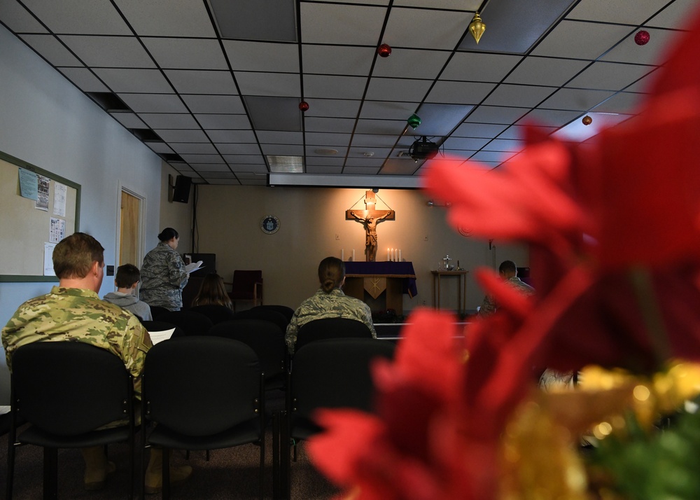 Airmen from the 104th Fighter Wing attend Candlelight service