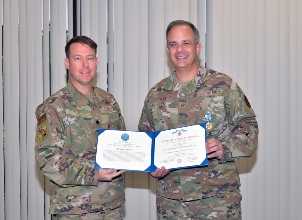 Airman receives the Joint Service Achievement Medal
