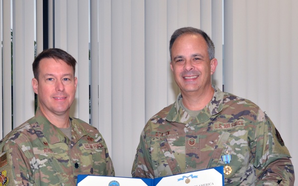 Airman receives the Joint Service Achievement Medal