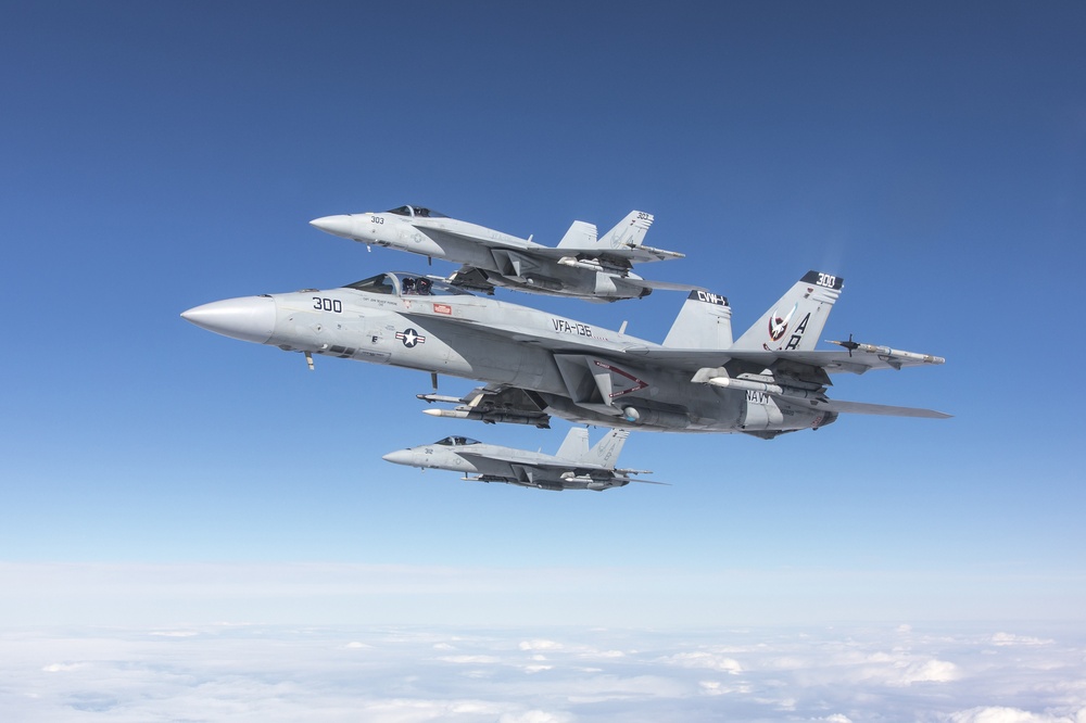 Three F/A-18E aircraft from Strike Fighter Squadron (VFA) 136 &quot;Knighthawks&quot; fly in formation over the Sea Test Range