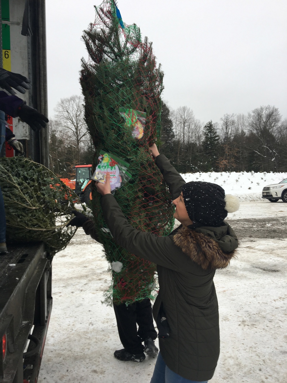 National Guard volunteers join veterans, volunteers for Trees for Troops loadout