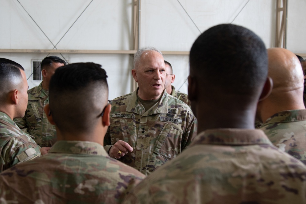 Maj. Gen. Bruce E. Hackett greets troops