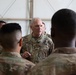 Maj. Gen. Bruce E. Hackett greets troops
