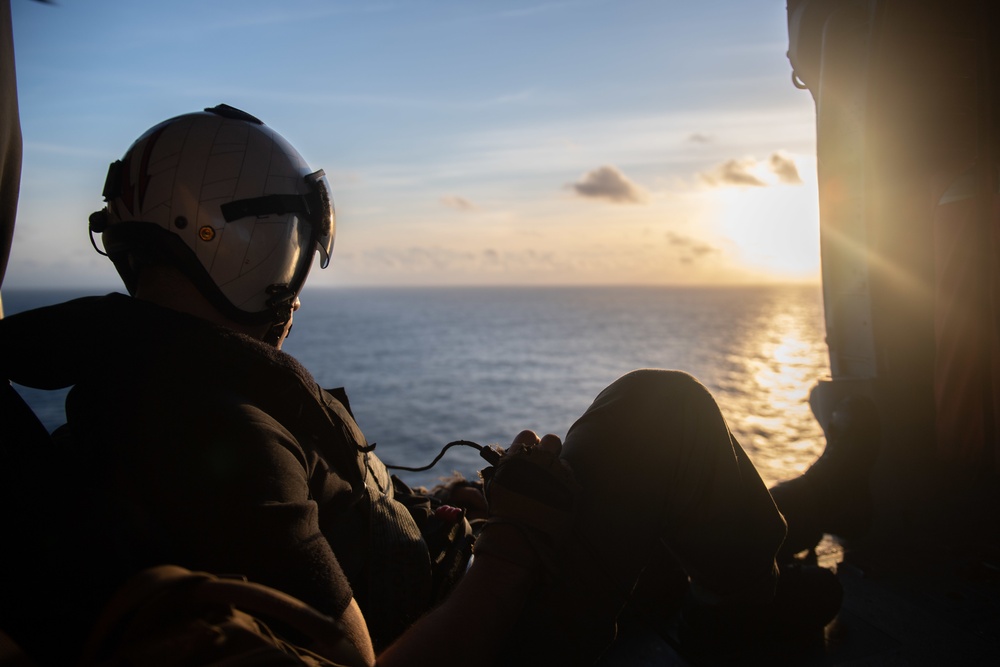 U.S. Air Crewman monitors flight activity