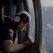 U.S. Navy Air Crewman prepares to land