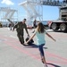 Chief Hull Maintenance Technician Leonard Roach, assigned to the submarine tender USS Emory S. Land (AS 39), reunites with his daughter during a homecoming gathering