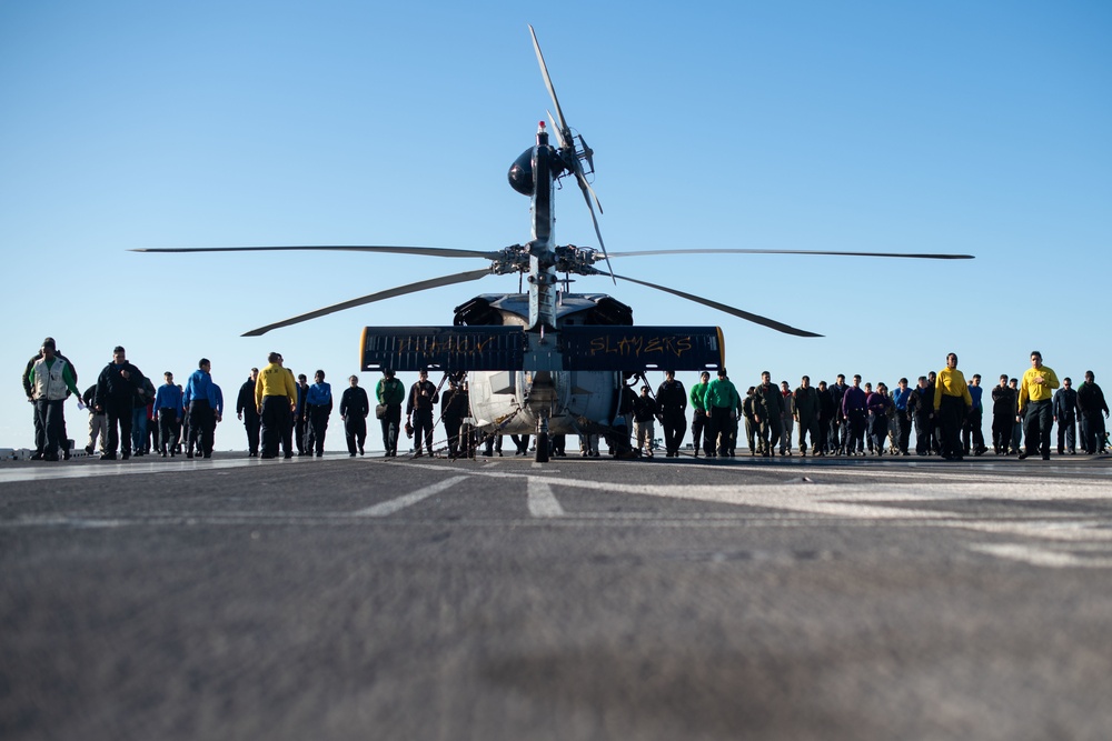 U.S. Sailors participate in a FOD walkdwon