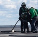 U.S. Sailors change an arresting gear wire