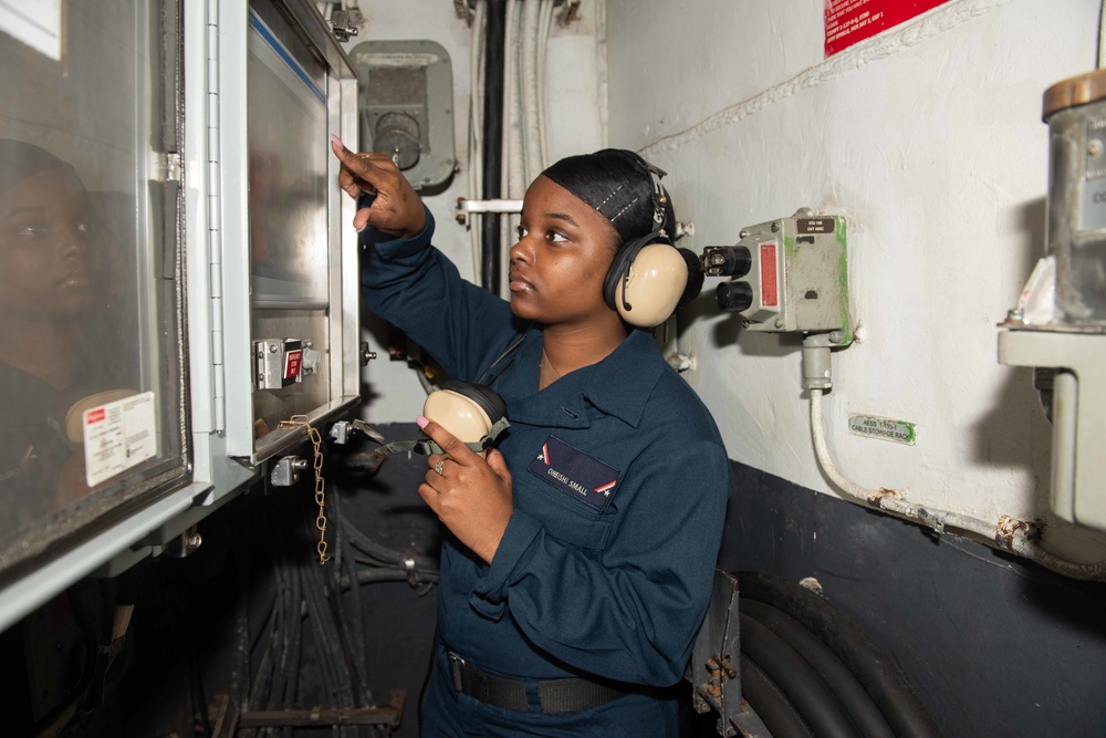 Sailor operates weapons elevator