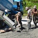 U.S. Navy Seabees from NMCB 5’s Detail Diego Garcia place concrete in support of the U.S. Air Force