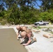 U.S. Navy Seabees from NMCB 5’s Detail Diego Garcia place concrete in support of the U.S. Air Force