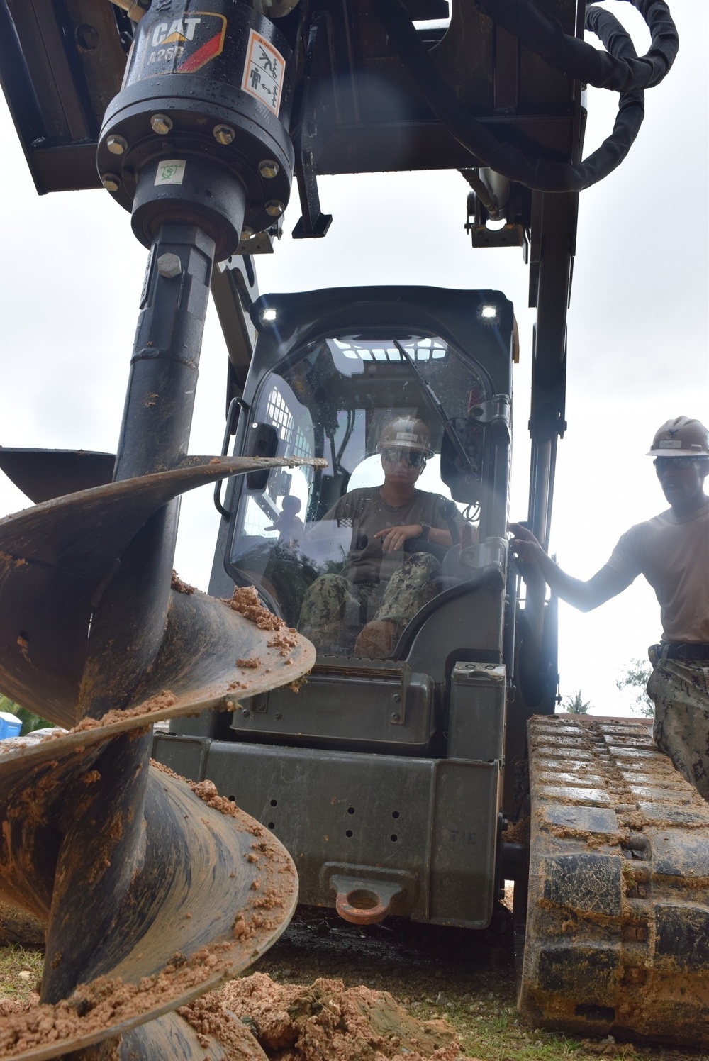 U.S. Navy Seabees deployed with NMCB-5’s Detail Tinian continue work on Explosive Ordnance Disposal Mobile Unit 5’s Boat Storage Facility