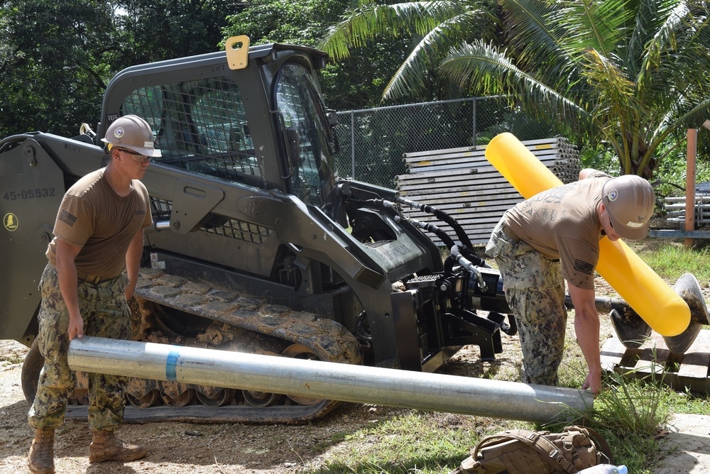 U.S. Navy Seabees deployed with NMCB-5’s Detail Tinian continue work on Explosive Ordnance Disposal Mobile Unit 5’s Boat Storage Facility