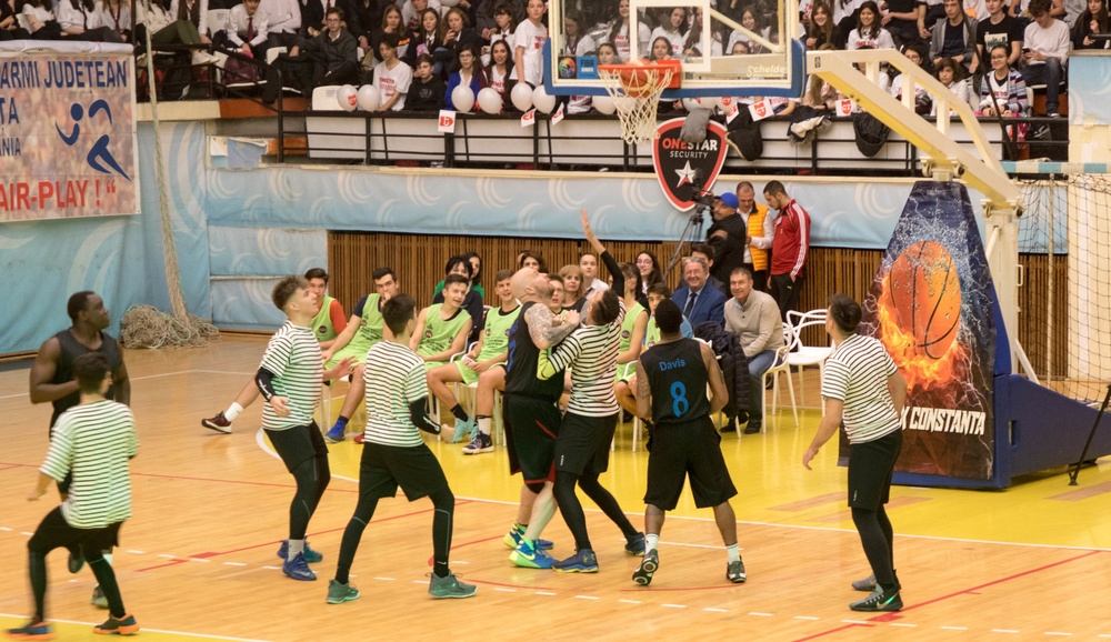 MKAB service members compete in a charity basketball game in Romania